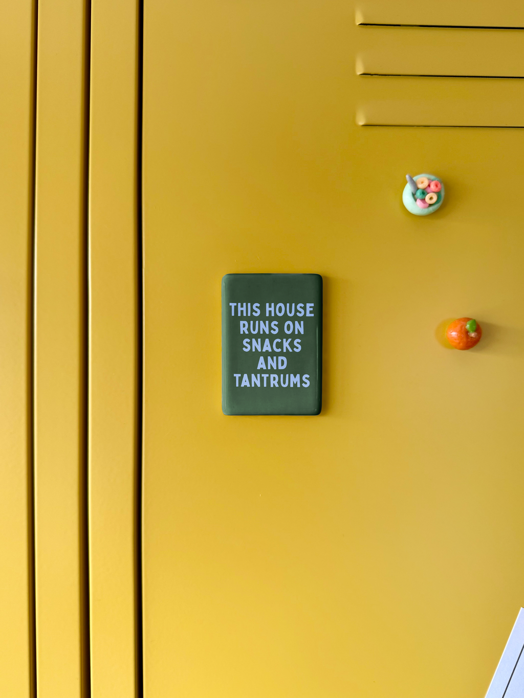 This House Runs On Snacks And Tantrums | Ceramic Magnet