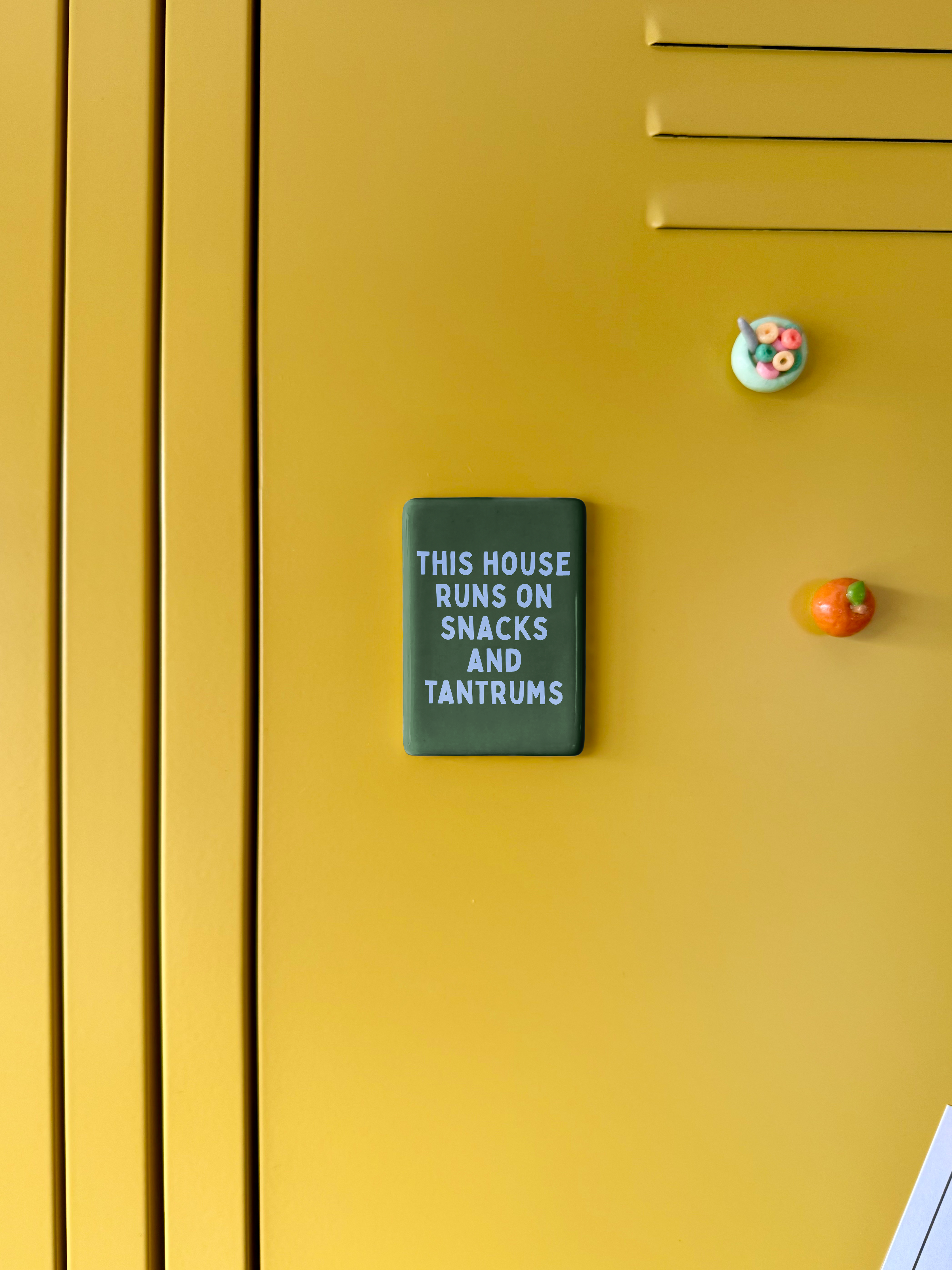This House Runs On Snacks And Tantrums | Ceramic Magnet